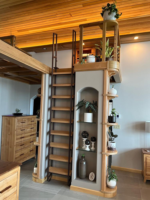 Steel and wood loft ladder in recessed hutch
