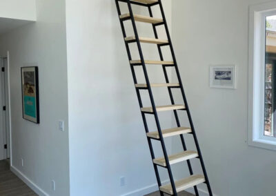 Steel and Wood Ladder In A Corner That Is Retracted Out