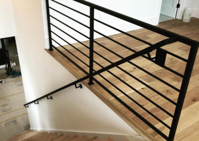 Simple Black Steel Partition Wall At Top of Stairs